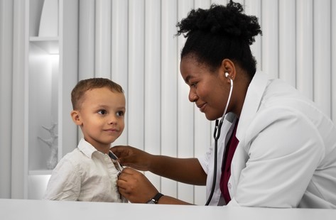 Doctor examining a child with stethoscope